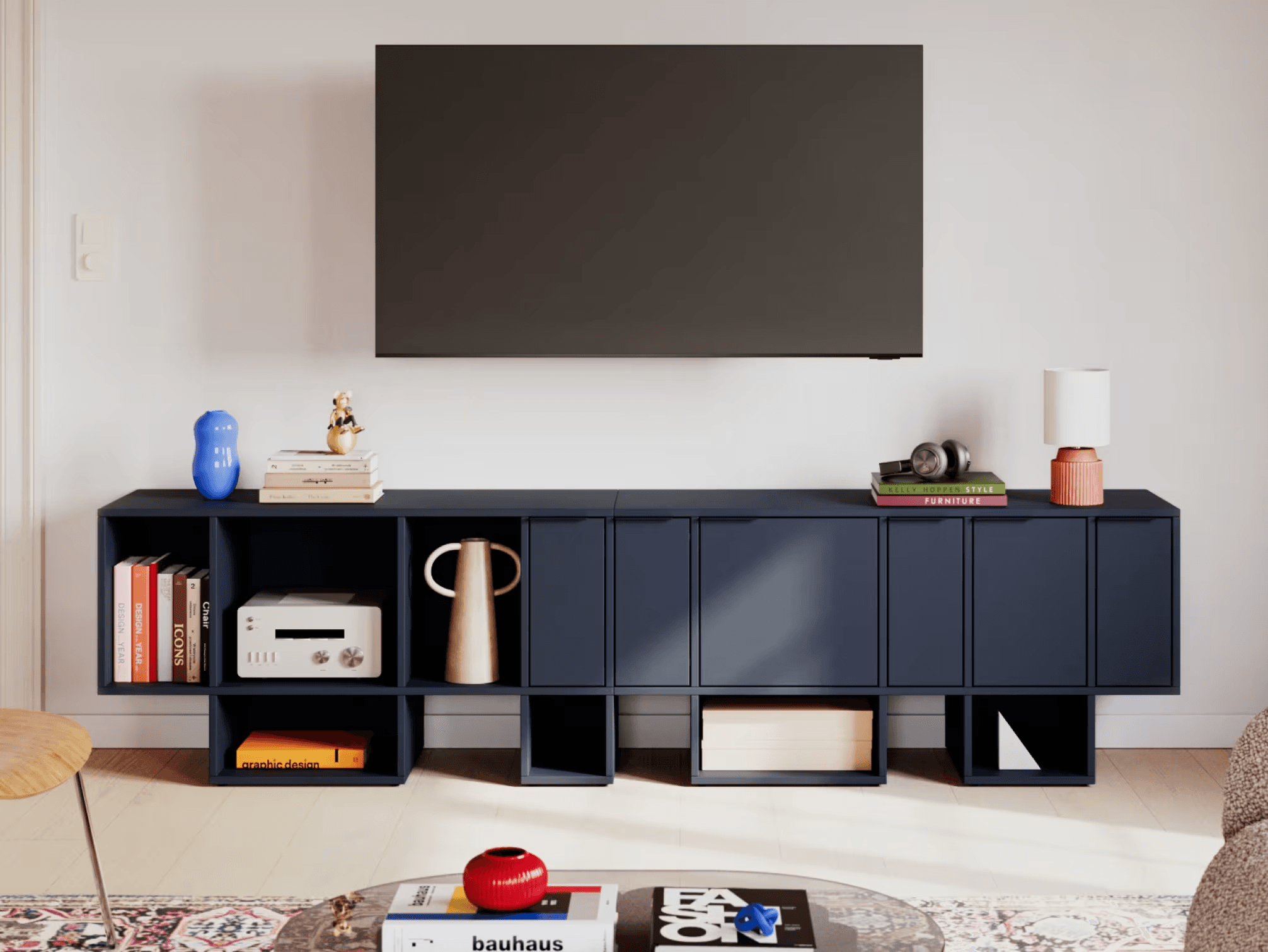 Modern TV stand and decor with books and vases